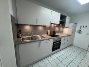 Kuchyň nebo kuchyňský kout v ubytování Waldnähe & Altstadtflair Souterrain mit Terrasse + 7 fotografií