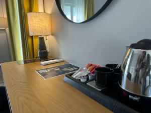 a coffee maker sitting on a desk in a hotel room at Hotel Puerta del Mar - Adults Recommended in Nerja