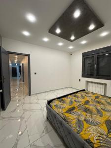 Katil atau katil-katil dalam bilik di Villa avec piscine Tlemcen