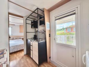 A bed or beds in a room at Amapolas - Villaggio & Camping