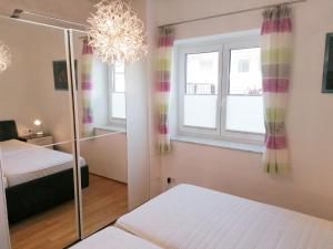 Ένα ή περισσότερα κρεβάτια σε δωμάτιο στο 4 Ferienwohnung Franziska