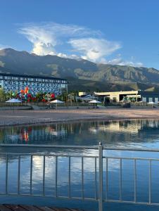 a view of a resort with mountains in the background at Issyk-Kul Novel in Korumdy