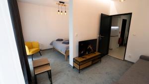 Μια τηλεόραση ή/και κέντρο ψυχαγωγίας στο Lima Apartment - Free Parking, Near City Center