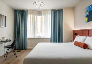 Postel nebo postele na pokoji v ubytování BYPILLOW Amari