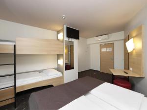 Postel nebo postele na pokoji v ubytování B&B HOTEL Berlin-Alexanderplatz