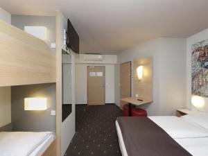 Postel nebo postele na pokoji v ubytování B&B HOTEL Berlin-Alexanderplatz