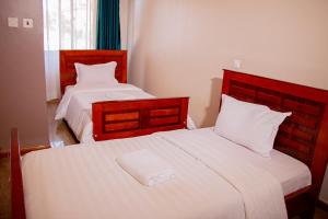 Postel nebo postele na pokoji v ubytování SEED HOTEL