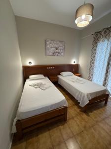 Postel nebo postele na pokoji v ubytování Jasmine Hotel & Apartments