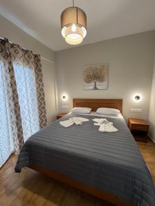 Postel nebo postele na pokoji v ubytování Jasmine Hotel & Apartments
