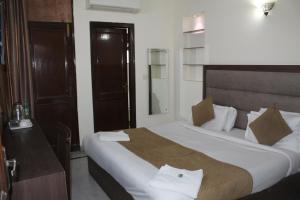 Ένα ή περισσότερα κρεβάτια σε δωμάτιο στο New South Paradise - Near Nehru Place