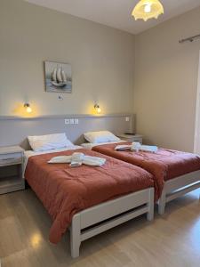 Postel nebo postele na pokoji v ubytování Jasmine Hotel & Apartments