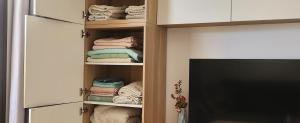 a closet filled with towels and a pile of towels at Playa del Ingles. Apartamento al lado del océano in San Bartolomé de Tirajana +39 photos