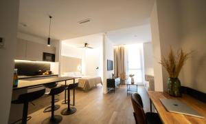 a room with a kitchen and a living room at Demetrio By Alma Suites in Valencia