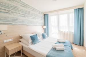 Postel nebo postele na pokoji v ubytování ALKA Sun Resort