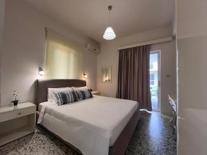 A bed or beds in a room at Nikos Studios