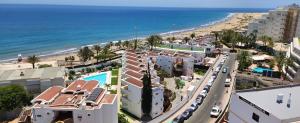 an aerial view of a beach and buildings at Playa del Ingles. Apartamento al lado del océano in San Bartolomé de Tirajana