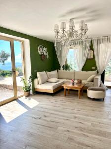 a living room with a couch and a table at Katerina's House in Volimes