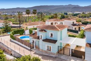 an aerial view of a house with a swimming pool at Villa Dalia by Villa Plus in Beniarbeig