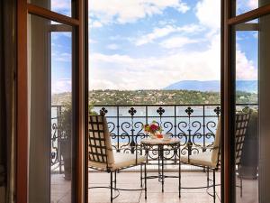 a balcony with a table and chairs and a view at The Woodward - Auberge Resorts Collection in Geneva