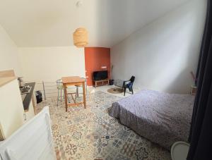 Ένα ή περισσότερα κρεβάτια σε δωμάτιο στο Appartement en Duplex