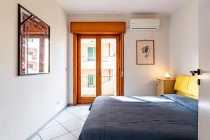 Ένα ή περισσότερα κρεβάτια σε δωμάτιο στο GuestHost - Casa Giovanna Lungomare Sea view