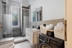 a bathroom with a sink and a washing machine at La casa di Licia in La Spezia +23 photos