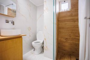 a bathroom with a toilet and a sink at Μi Casa Su Casa Apartment in Heraklio Town