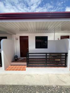 a view of the front porch of a house at L&G Tourists Inn in Moalboal