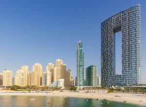 a view of a city with a beach and buildings at Happy ACADEMIA JBR in Dubai