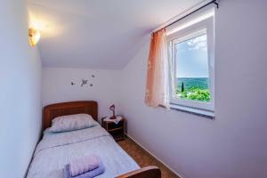 Postel nebo postele na pokoji v ubytování Apartments Rose