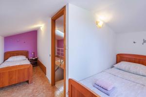 Postel nebo postele na pokoji v ubytování Apartments Rose