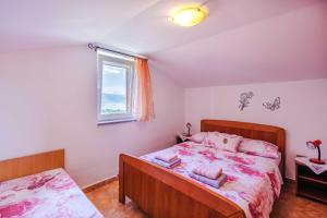 Postel nebo postele na pokoji v ubytování Apartments Rose