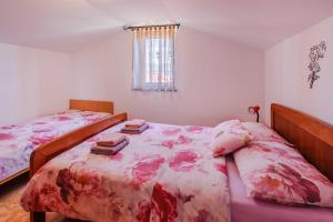 Postel nebo postele na pokoji v ubytování Apartments Rose