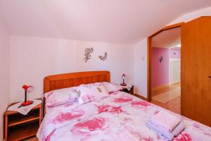 Postel nebo postele na pokoji v ubytování Apartments Rose