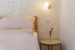 Postel nebo postele na pokoji v ubytování Apartments Rose