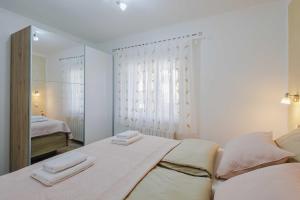 Postel nebo postele na pokoji v ubytování Apartments Rose