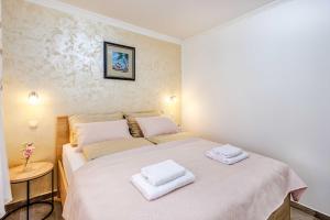 Postel nebo postele na pokoji v ubytování Apartments Rose