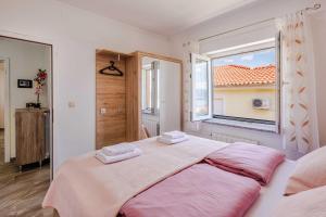 Postel nebo postele na pokoji v ubytování Apartments Rose