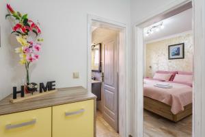 Postel nebo postele na pokoji v ubytování Apartments Rose