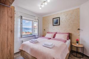 Postel nebo postele na pokoji v ubytování Apartments Rose