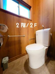 a bathroom with a white toilet in a room at Stay Like a Local Hiroshima Hiroshima Station Entire House 1-6 ppl in Hiroshima +47 photos