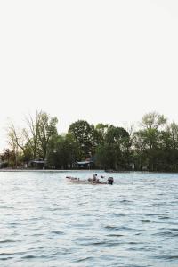 two people in a boat on the water at Buckeye Lake Cottage in Buckeye Lake