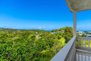 an ocean view from the balcony of a house at Tropical Paradise in Rincon in Aguada