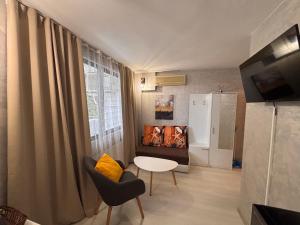 A television and/or entertainment centre at Sozopol Romance Apartments