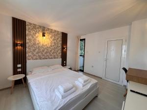 A bed or beds in a room at Sozopol Romance Apartments