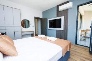 Postel nebo postele na pokoji v ubytování Boulevard Hotel