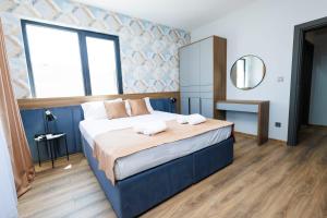 Postel nebo postele na pokoji v ubytování Boulevard Hotel