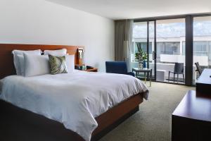 a hotel room with a large bed and a desk at Tower 23 Hotel in San Diego