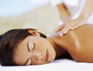 a woman laying on her back on a bed at Les Suites d'Aliénor-Suite Mimosa in Pessac