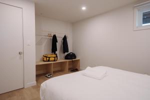 Cama o camas de una habitación en Chalets OST Shefford FORFAIT GROUPE